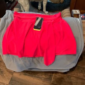 A red Nike skirt I bought it for tennis but doesn’t have underwear underneath.